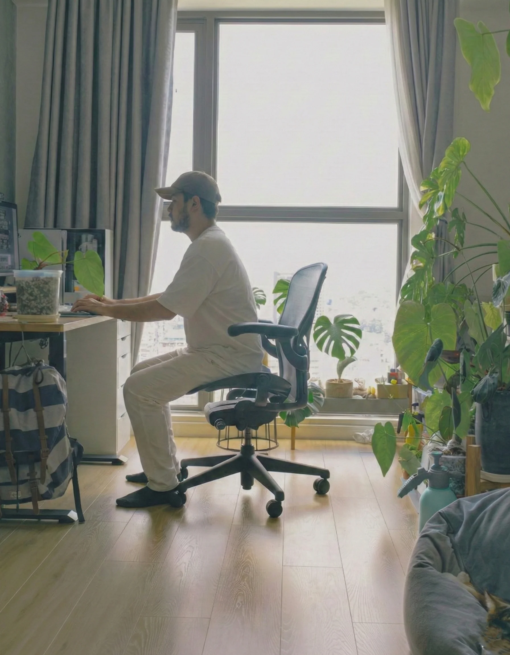 Melih sitting at desk